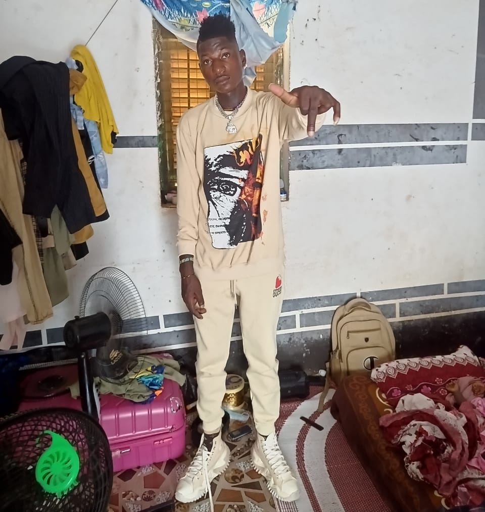 Prompt: ALi Boubacar dons head to toe white attire after leaving meeting 