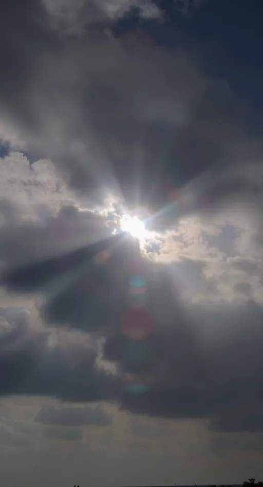 Prompt: कालो बादलको बीचमा घाम झुल्किरहेको
