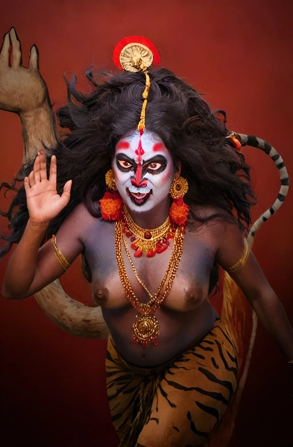 Prompt: Ma Kali riding a lion or tiger, her hair wild and flowing, symbolizing her untamed and fearless nature.