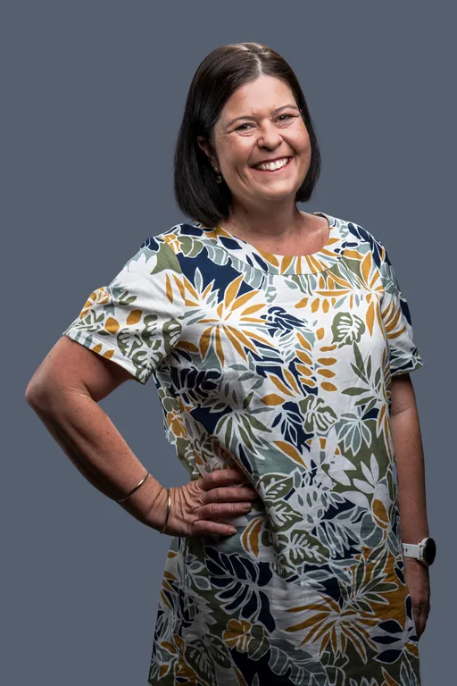 Prompt: Please create a boxed doll of Wendy Victor from Dynamic Express, a freight company. She is a tri-athlete, a supermom to 3 boys