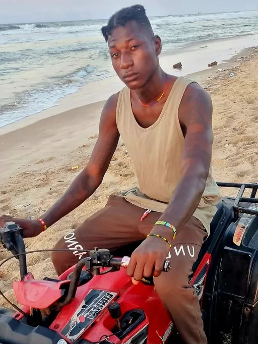 Prompt: ALi Boubacar unleashed the power of a quad bike on the sandy shores.