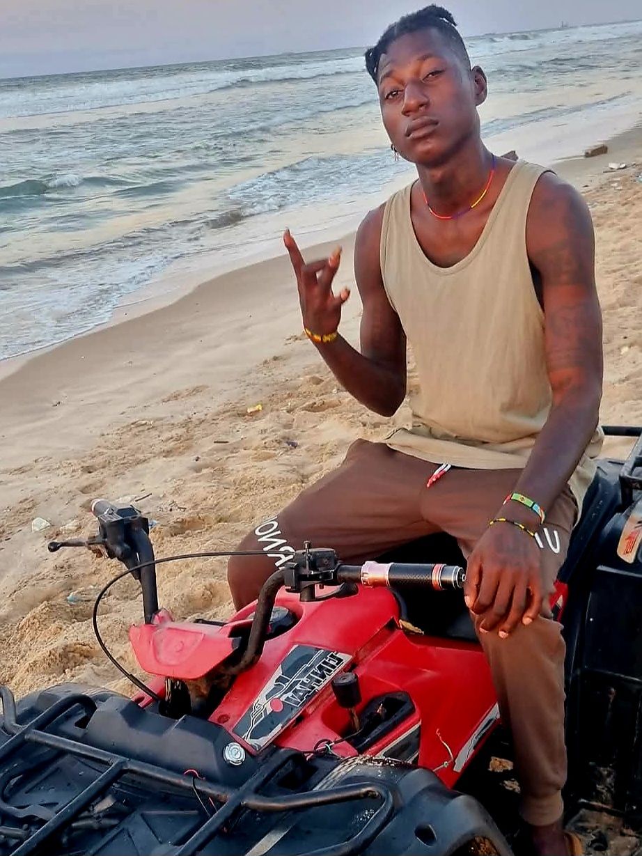 Prompt: ALi Boubacar explored the beach on a powerful quad bike.".