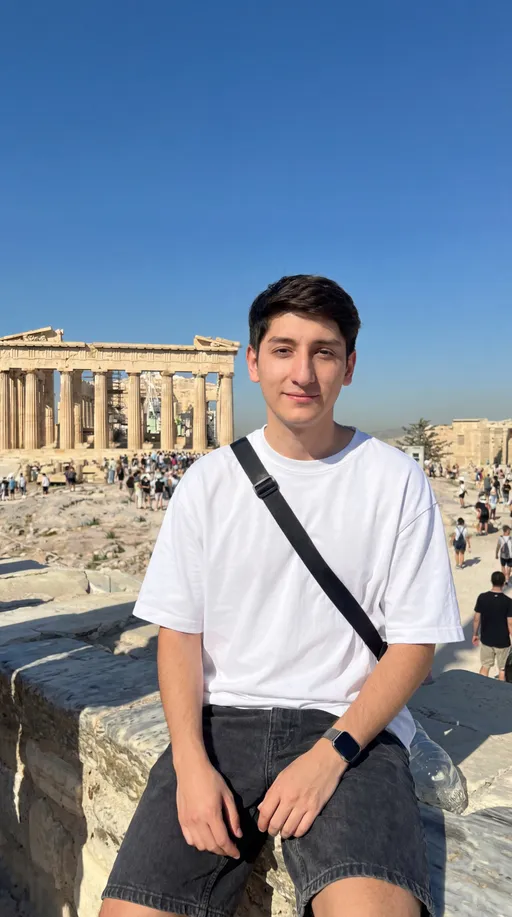 Prompt: Can you replace me with the guy in the picture and make it look as real as possible in the highest definition 8k. Make my body a skin tone lighter and skinnier as im a slim 30 year old adult. Keep the background and lightning the same. Also have me wear a oversized white T shirt.
