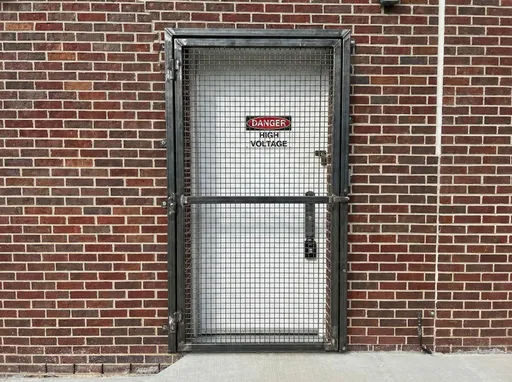 Prompt: Create a fabricated steel security cage to go flat over the door in the picture. Don't change the background, just super impose a cage of the box in the current picture. Have the case have small cage grade but heavy steel. Have the steel have smaller cage gaps, harder for someone to cut into with cutters