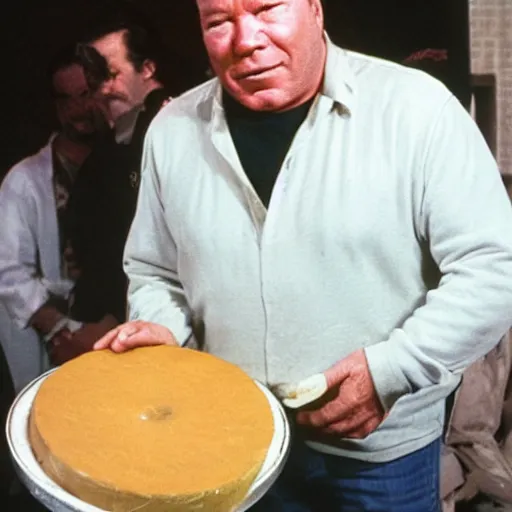 Image similar to william shatner eating a large wheel of cheese,