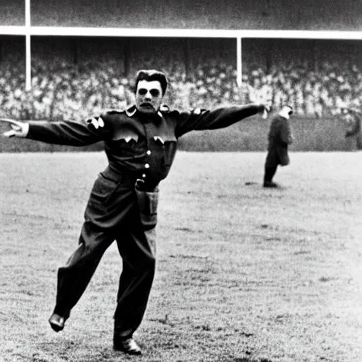 Image similar to stalin stands at the gate on the football field and catches the ball, photo of stalin at the stadium