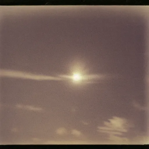 Image similar to an unidentifiable flying object flying through the sky, blurry photo, old polaroid, expired film, historical photo,