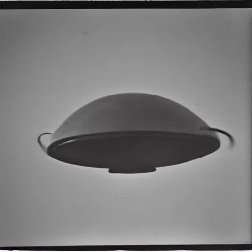 Prompt: polaroid photograph of ufo taken in the sky, hanebau, 1 9 5 0 s, black and white, blurry