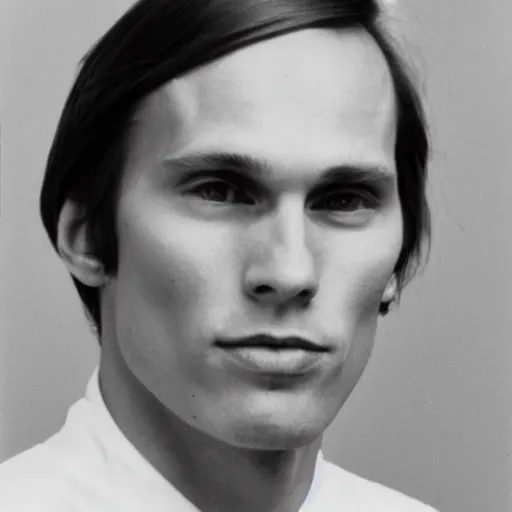 Image similar to A photograph portrait of Jerma985 with short-medium length hair a combover wearing early 1970s menswear in the early 1970s, taken in the early 1970s, grainy, taken on a 1970s Polaroid Camera, realistic, hyperrealistic, very realistic, highly detailed, very detailed, extremely detailed, detailed, digital art, trending on artstation, colorized photo