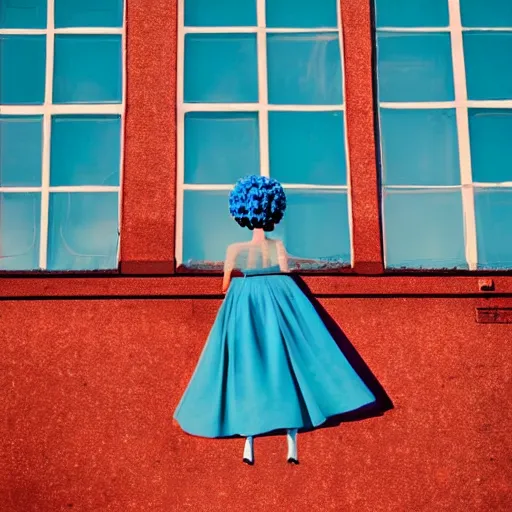 Image similar to giant flower head, girl standing by 1 9 6 0 window, surreal photography, symmetry, mid century, flat perspective, bright colours, blue sky, realistic, wes anderson