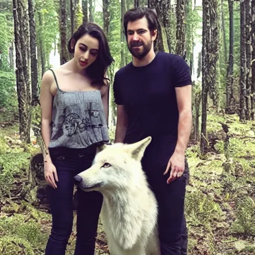 Image similar to adelaide kane standing next to a large white wolf in a forest