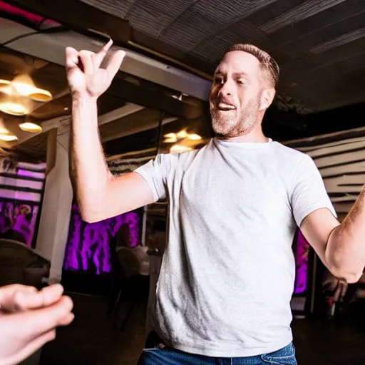 Image similar to photo of a 4 0 year old white man living thinking he's living the best life possible. he looks young for his age. he is at a dance club, it's as if he were in a music video. young woman can be seen dancing around him in a seductive manner.