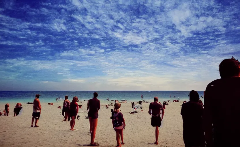 Image similar to sunny day at the beach blue sky big explosion on the horizon and few people watching it war apocalyptic photorealistic