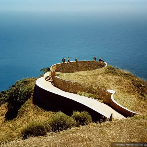 Image similar to castle designed by renzo piano overlooking big sur. landscape design by andre le notre. fujinon premista 1 9 - 4 5 mm t 2. 9. portra 8 0 0. w 1 0 8 8