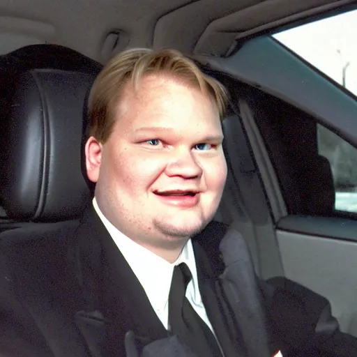 Image similar to 1 9 9 8 andy richter wearing a black wool coat and necktie in his car driving through the streets of chicago at night, pov back seat of car, cozy atmosphere