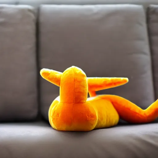 Image similar to colorful charizard fluffy plushy toy on the side of a couch, close up dslr photo