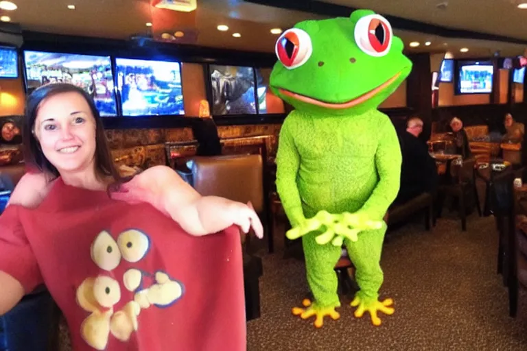 Image similar to taking a selfie with a frog fleshy mascot costume at an applebee's, cell phone photo