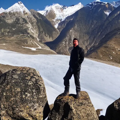 Prompt: man standing on rocks covered with snow mountain top in background