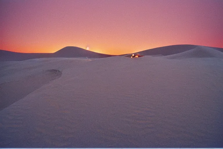 Prompt: blue hour, sand dunes beneath fire, 35mm, film photo, steve mccurry