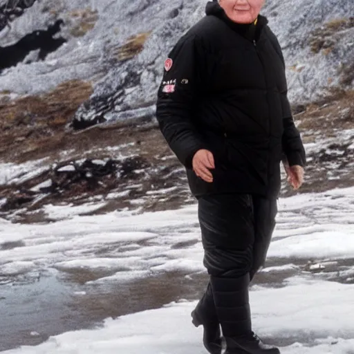Image similar to john paul ii standing in a black puffed nuptse, black cargo pants and high black boots, summer weather