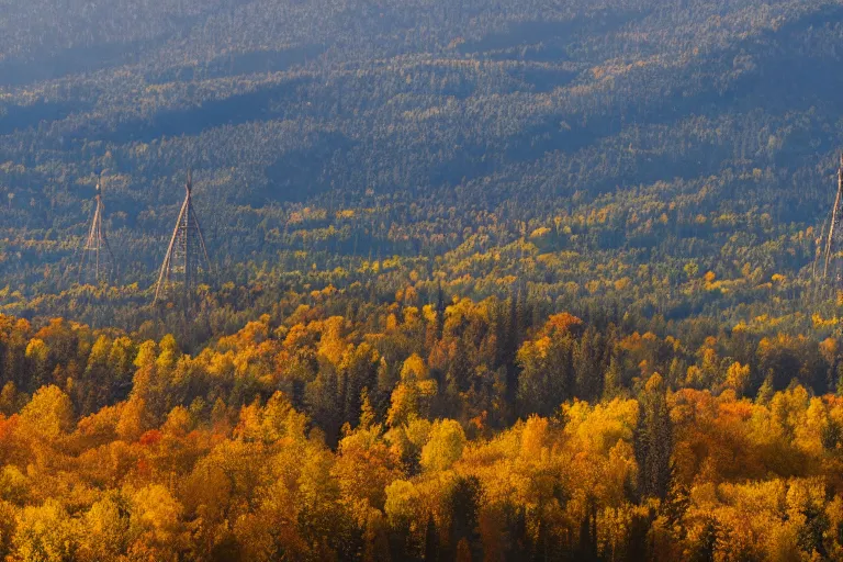 Image similar to a mountain with a radio tower next to a pond, autumn hills in background. telephoto lens photography.