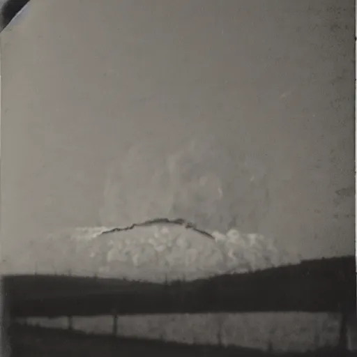 Image similar to a very bright flash in the sky, a large explosion in the distance, taken on a ww 2 camera, very high bloom ammount, realistic, the photograph is very dirty.