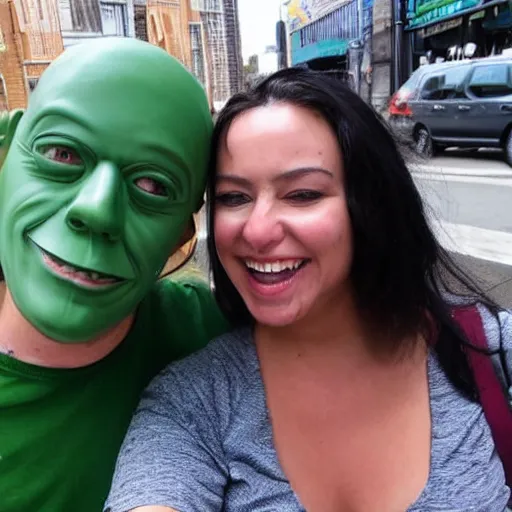 Prompt: a man in a green rubber mask takes a selfie with a girl