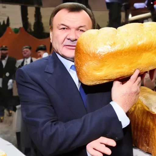 Image similar to Yanukovych and the golden loaf of bread