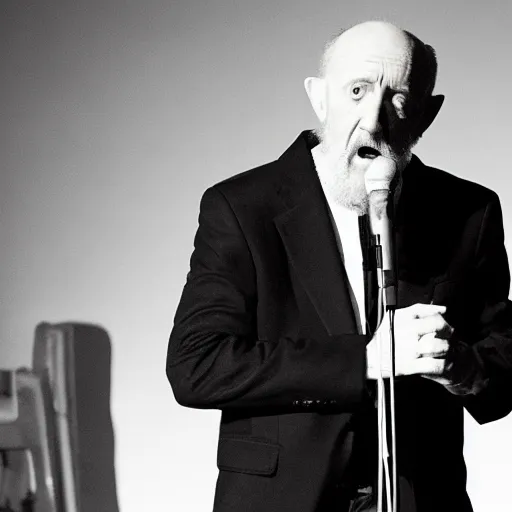 Image similar to mike ehrmantraut pretending to be george carlin on stand up night