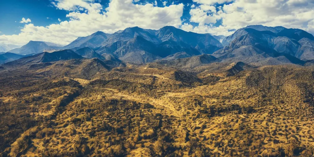 Image similar to drone shot photo of a landscape with mountains and acanyon, wallpaper, very very wide shot, national geographic, award landscape photography, professional landscape photography, sunny, day time, beautiful