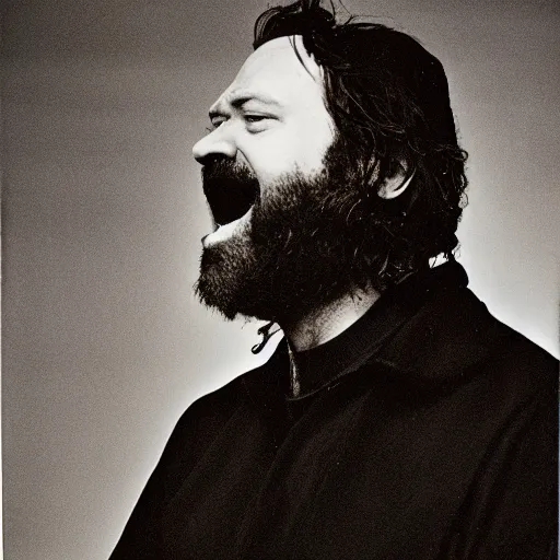 Image similar to Singing Thoooom Yooooorke, with a beard and a black jacket, a portrait by John E. Berninger, dribble, neo-expressionism, uhd image, studio portrait, 1990s