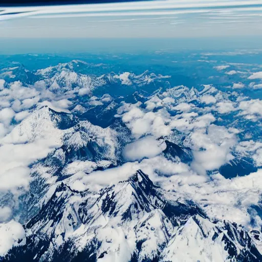 Prompt: mountain view from the window of an airplane