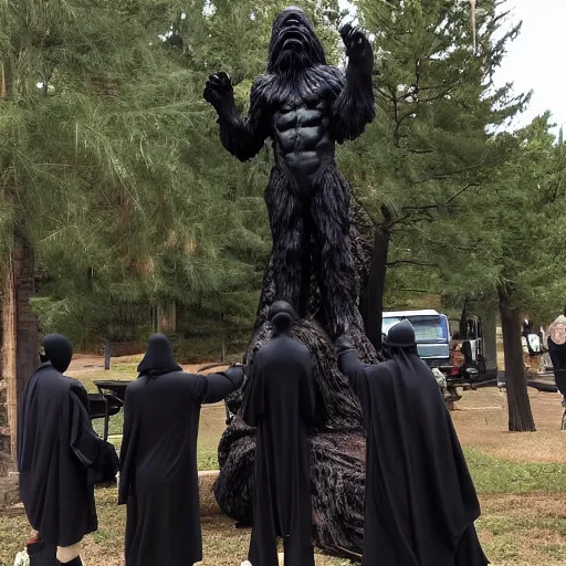 Image similar to black robed group of occultist worshipping a bigfoot statue