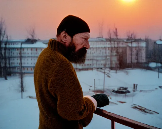 Image similar to lomographic tarkovsky film still of 4 0 years russian man with beard and sweater standing on small hrushevka 9 th floor balcony full with cigarette smoke in winter taiga looking at sunset, cinestill, bokeh