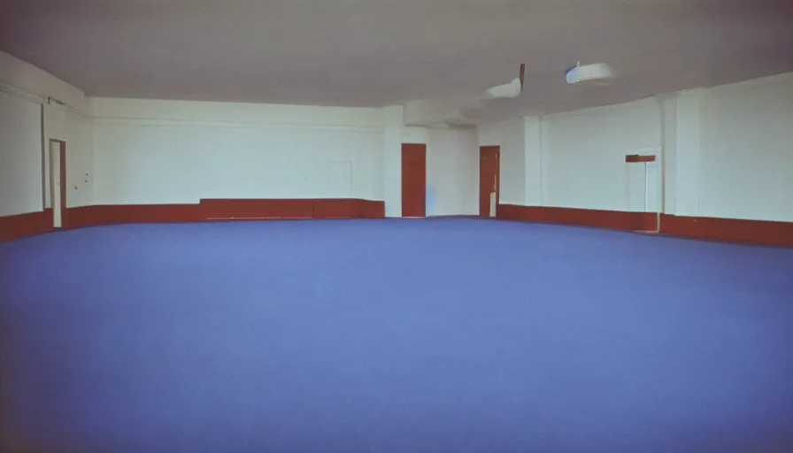 Image similar to 60s movie still of a sovietic stalinist style empty ballroom with blue beds, cinestill 800t 50mm eastmancolor, liminal Space style, heavy grain, flash-s 150