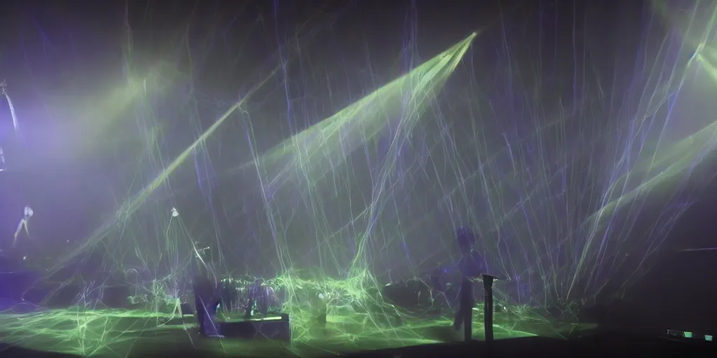 Image similar to Thom Yorke singer songwriter, Radiohead group of people on stage playing instruments, elaborate stage effects, dust, smoke, giant LED screens, colored projections, ultrafine detail, glowing thin wires, smoke, high contrast, projections, a screenshot by David Gilmour Blythe, holography, tesseract, volumetric lighting, anamorphic lens flare