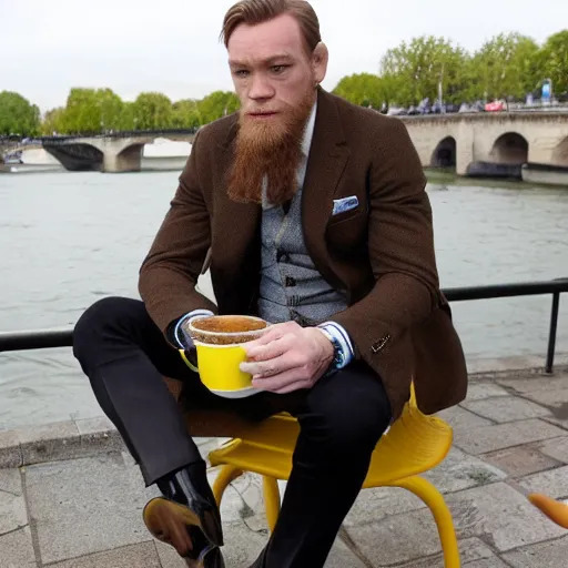 Image similar to mcgregor is dressed as a gentleman at early 2 0 th century paris. he is having a coffee at the banks of river seine. ewan mcgregor has a coffee cup on his hand. next to him is a small brown cat with yellow glowing eyes, by jack kirby