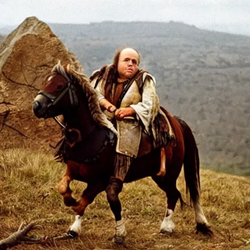 Image similar to Danny DeVito as a Hunnic barbararian on a horse, at the top of a hill overlooking a battleground campsite, film still