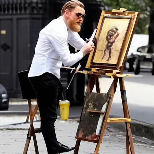 Image similar to clean shaven mcgregor is dressed as a gentleman at early 2 0 th century paris. he is watching an easel. that easel has a canvas on it. ewan mcgregor has a brush on his hand. he is painting a painting. there is a small brown cat with yellow eyes on ewan mcgregors feet. ewan mcgregor ´ s back