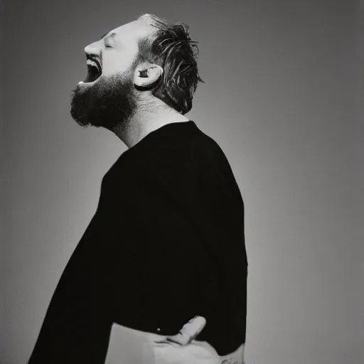 Prompt: Singing Tthhoomm Yyoorrkkee, with a beard and a black jacket, a portrait by John E. Berninger, dribble, neo-expressionism, uhd image, studio portrait, 1990s