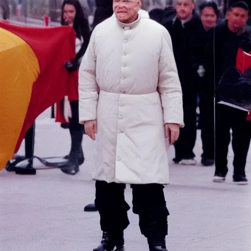 Prompt: john paul ii standing in a black puffed nuptse, black cargo pants and high black boots, summer weather