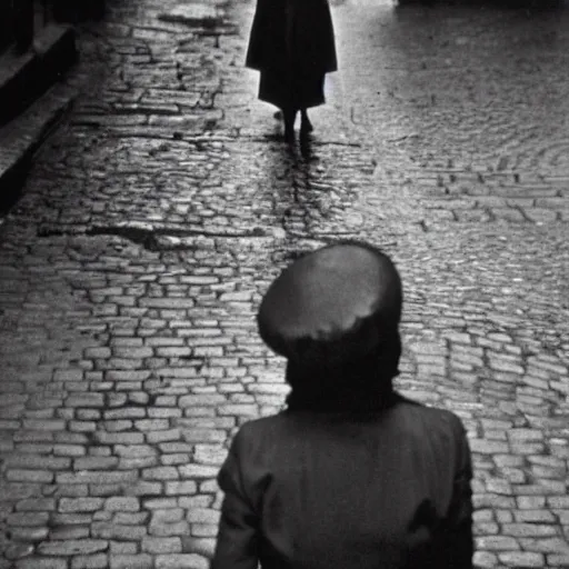 Image similar to fine art photograph of a woman seen from behind she is waiting for the rain to stop, cobblestone street, by henri cartier - bresson