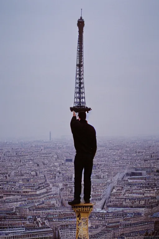 Prompt: photograph of a guy standing on top of the eiffel tower, portra 8 0 0