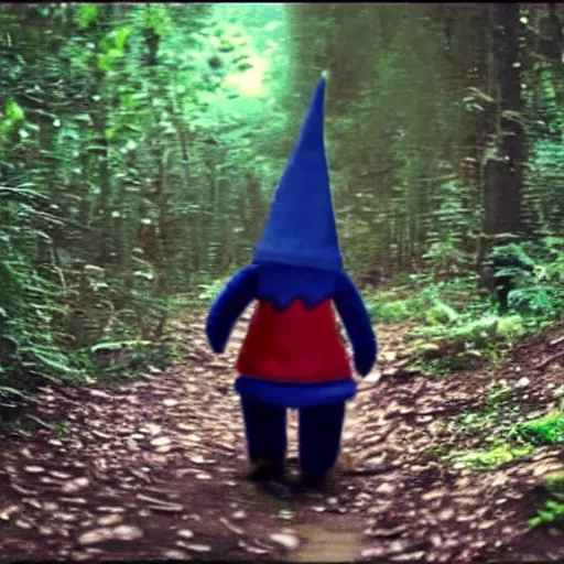 Image similar to bad quality screenshot of a leaked video of a small creature dressed as gnome walking through a forest trail, photo taken from far awar, bright camera flash, disturbing, very scary, realistic, very disturbing, ultrarealistic, 480p