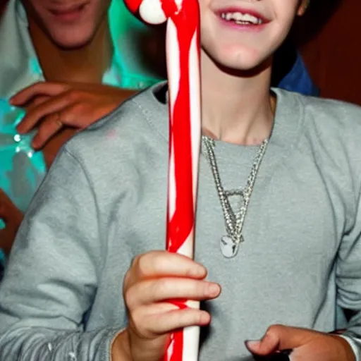 Image similar to justin bieber holding a candy cane,