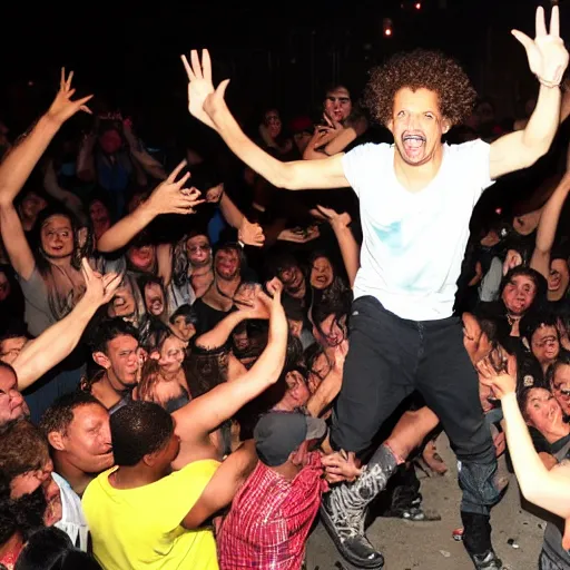 Prompt: eric andre posing for a picture in a mosh pit