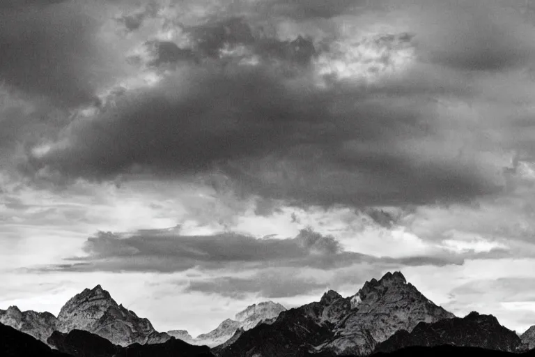 Image similar to small alien spaceship in the background, mountains, in the style of ansel adams, black and white, old, master photography by ansel adams