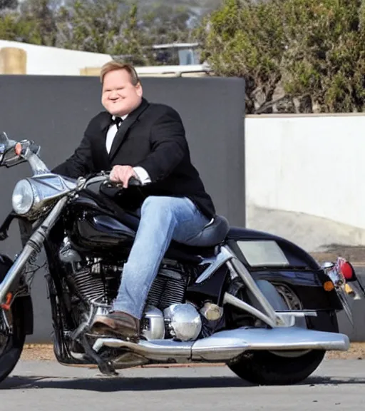 Image similar to Andy Richter is dressed in a black suit and a red necktie and riding a motorcycle into a studio lot. The studio lot is filled with Soundstages and movie trailers. It is a bright afternoon and overcast.