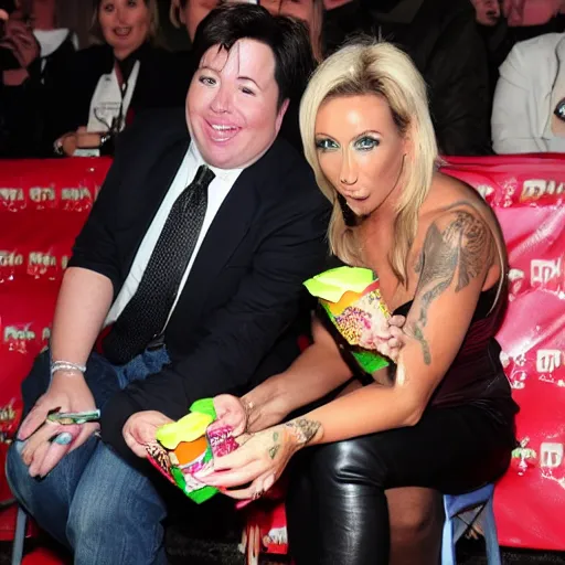 Image similar to Michael Mcintyre sitting next to Jodie Marsh eating ice creams