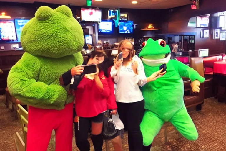 Image similar to taking a selfie with a frog fluffy mascot costume at an applebee's, cell phone photo